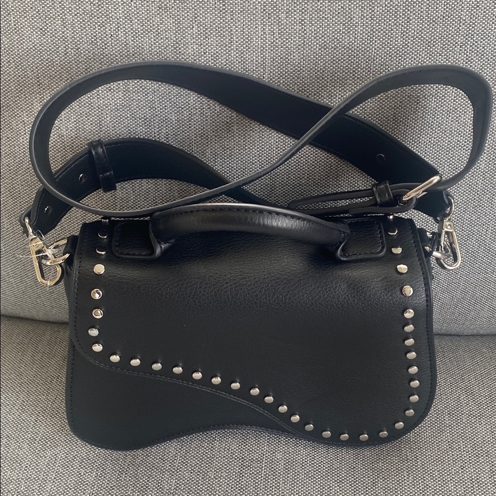 BCBGeneration black faux leather studded edgy 
saddle bag New but has marks